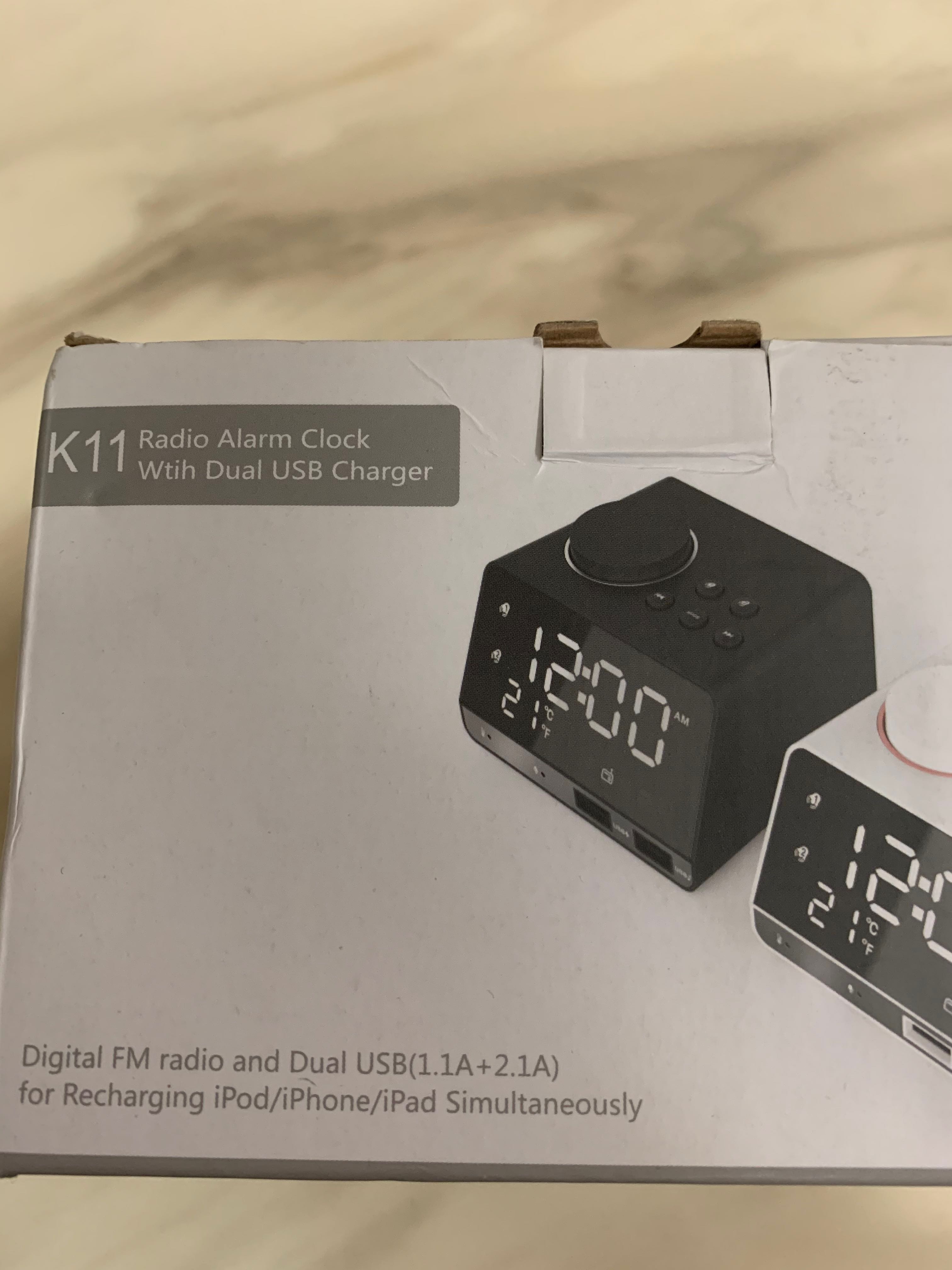 Radio alarm clock with dual USB charger to charge your iPhone and