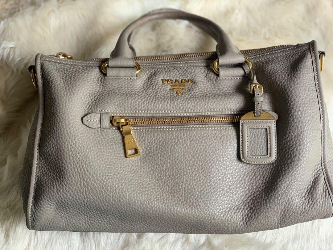 Authentic Prada Bag (Category: Luxury Bags & Wallets) located in Quezon City. Submitted by kimhailey (Listing ID 1075351180, Image 3). Description: Authentic💯 with entrupy certificate Prada Bag - Vitello Daino in Pomice condition: 8/10 with minimal flaws see pic 7 & 8 inclusion of strap, cards & dust bag Rfs: decluttering.