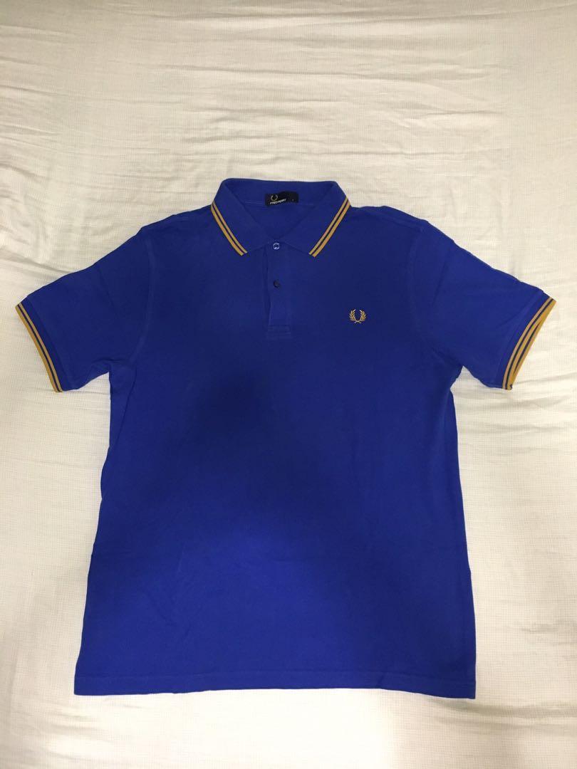 Fred Perry Polo Shirt (Blue/Gold) (Category: Tshirts & Polo Shirts ) located in Taguig. Submitted by monozcart (Listing ID 1075612341, Image 3). Description: - Original - With minor stains from storage (see last 2 pics).