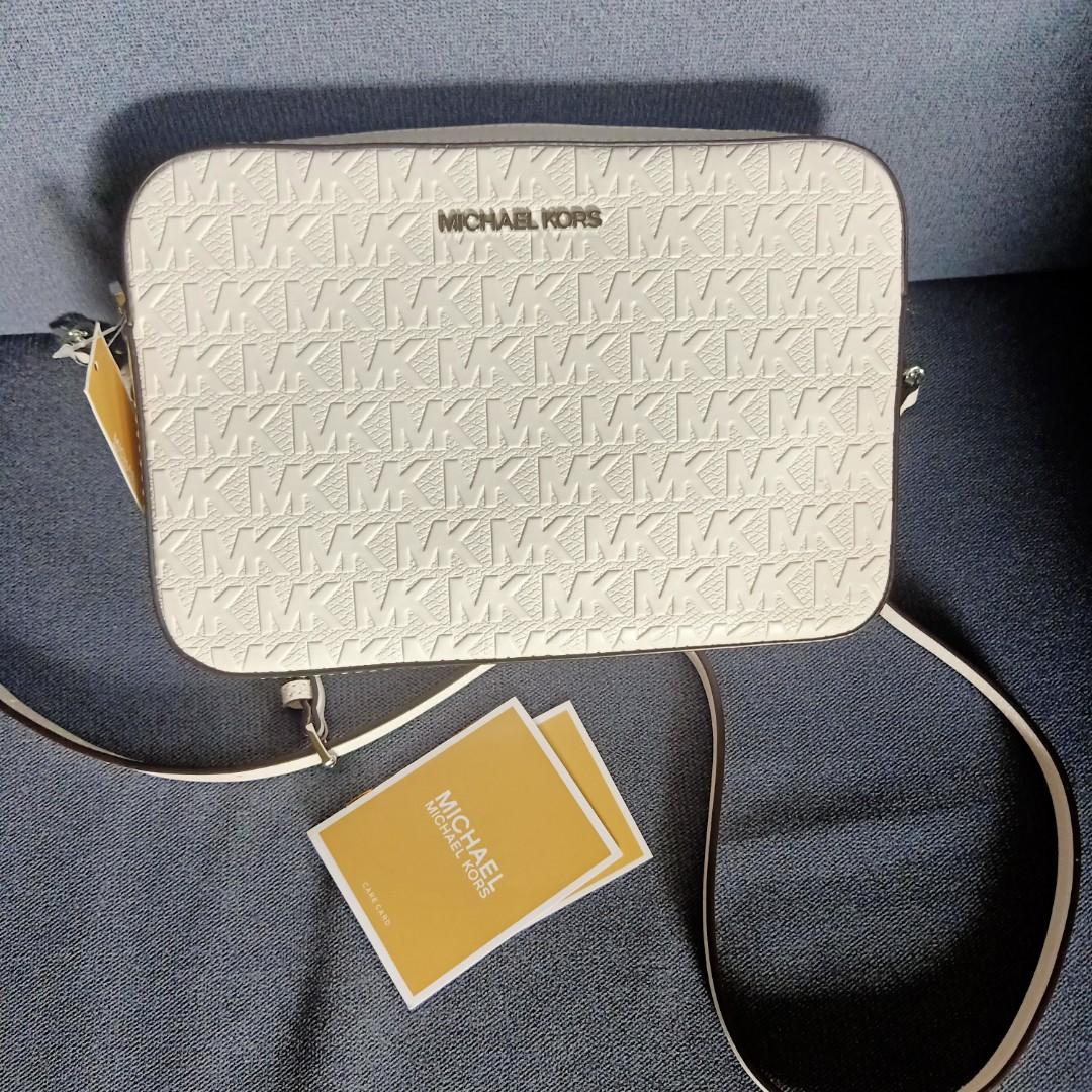 Mk jetset white embossed sling bag