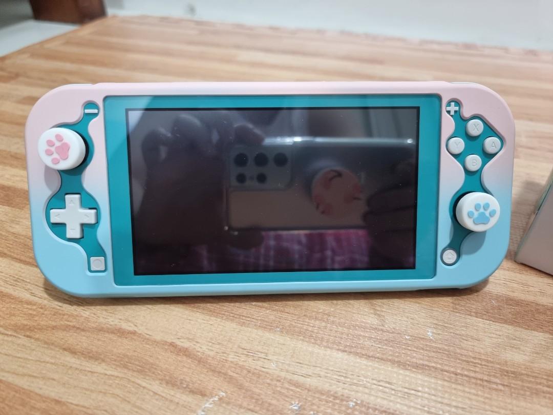 Nintendo Switch Lite (Category: Nintendo) located in Quezon City. Submitted by iamatractivo_ph (Listing ID 1075602783, Image 2). Description: Nintendo Switch Lite Color Turquoise Complete with Box and Accessories Excellent and Mint Condition.
