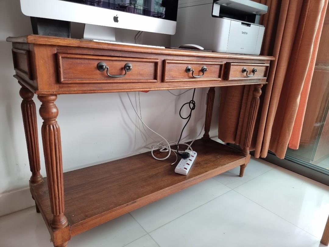 Solid Teakwood Study Table/Computer Table (Category: Tables & Sets) located in Singapore. Submitted by flo-rida (Listing ID 1075504618, Image 2). Description: Hi there as shown in the pics am selling a solid teakwood study/computer table. price:$250. Dimensions: L 47", H 30", W 15.5". Condition:8/10. Only a few scratches. but this wood can be varnish to give it a brand new look. Interested parties can PM me. thanks.