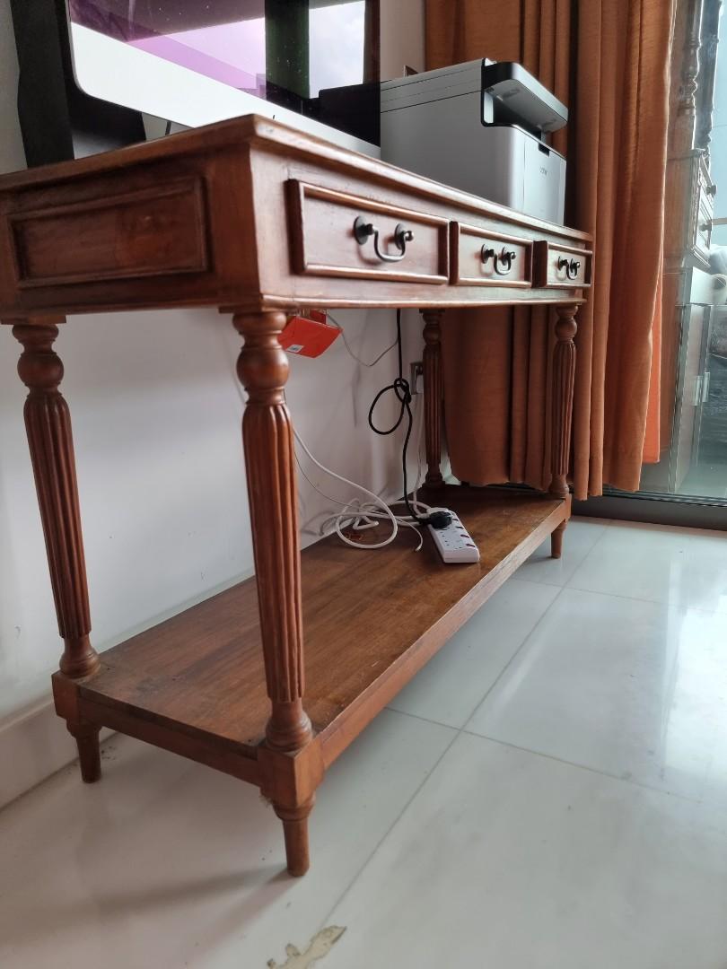 Solid Teakwood Study Table/Computer Table (Category: Tables & Sets) located in Singapore. Submitted by flo-rida (Listing ID 1075504618, Image 3). Description: Hi there as shown in the pics am selling a solid teakwood study/computer table. price:$250. Dimensions: L 47", H 30", W 15.5". Condition:8/10. Only a few scratches. but this wood can be varnish to give it a brand new look. Interested parties can PM me. thanks.