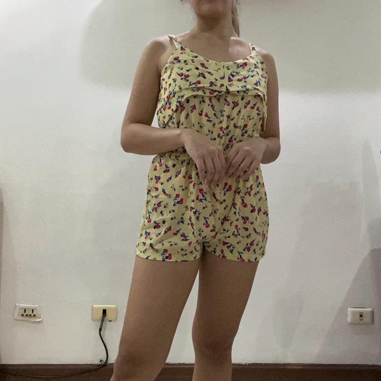Yellow Floral Romper (Category: Rompers) located in Manila. Submitted by teasthings (Listing ID 1075503477, Image 1). Description: Yellow Floral Romper • Size: S • Color: Yellow with floral pattern • Style: Sleeveless, romper shorts, subtle ruffle detail • Preloved • Well-kept, in excellent condition Model’s measurements • Waist: 28 in • Height: 5 ft 2 in, 157 cm.