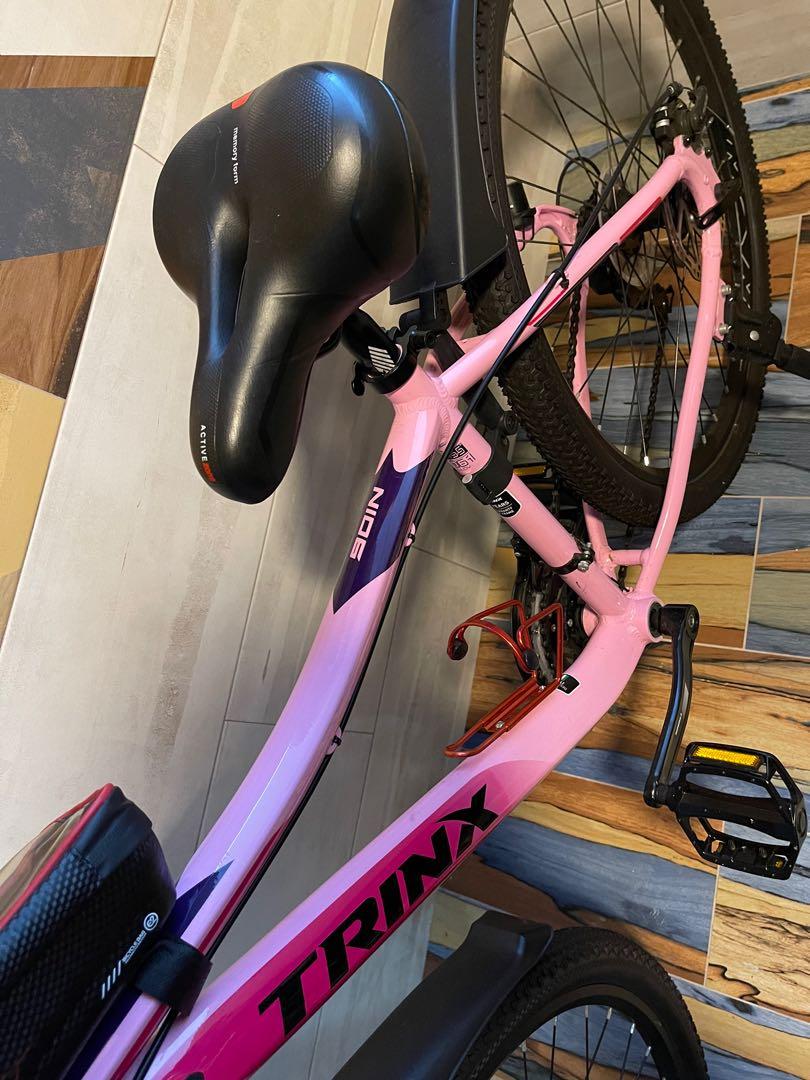 Trinx mountain bike pink top