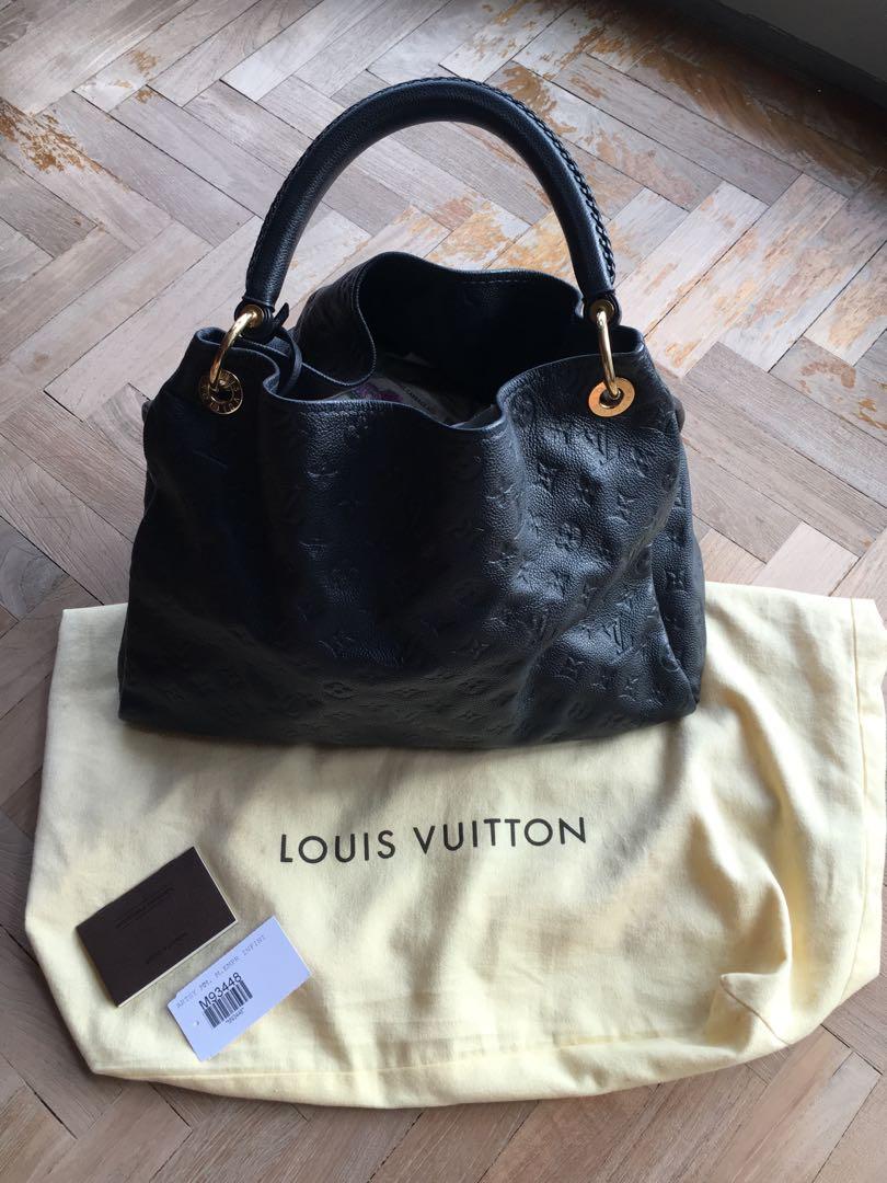 This Louis Vuitton Monogram Empreinte Leather Artsy MM will melt