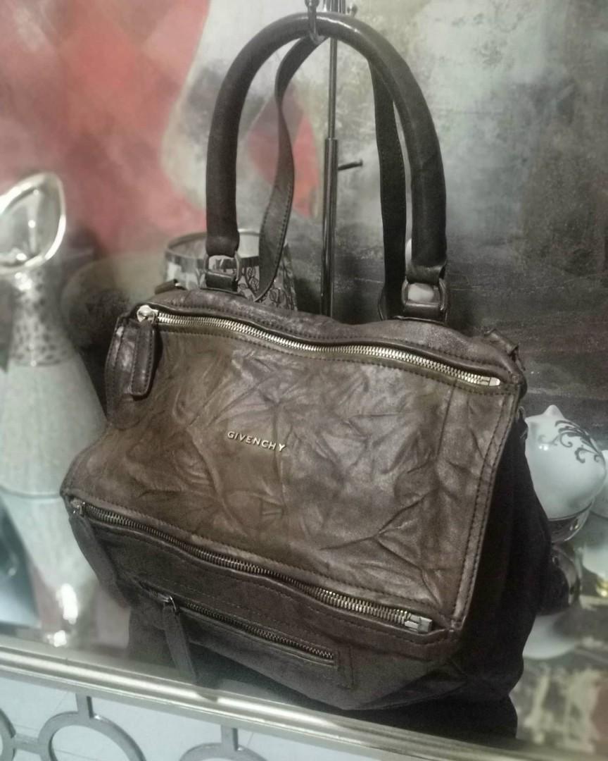 💜💕Givenchy Pandora Medium (Category: Luxury Bags & Wallets) located in Quezon City. Submitted by wheremyheart_is (Listing ID 1072678591, Image 1). Description: <item is available as long as posted> *very hard to come by, well-loved con.,sign of usage, minimal handle rubber lining rubs/scuffs hence selling low, genuine wrinkled sheep leather, ykk etched zippers with no.8 digit marking *pls.self authenticate..classy rugged carefree babe.