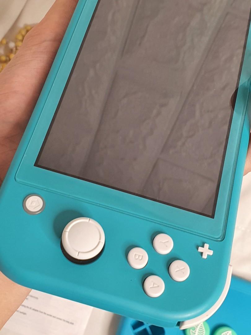Nintendo Switch Lite Teal Like New with free games, Video Gaming, Video ...