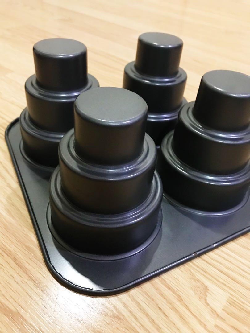 3-tier Mini Cake Pan (Category: Bakeware) located in Quezon City. Submitted by beap_ (Listing ID 1076434927, Image 3). Description: *Bought for ₱1550 *Brand: Chicago Metallic *seldom used *makes 4 pcs of mini 3-tiered cakes 😊 *no box If product listing is still active, it’s still available. .