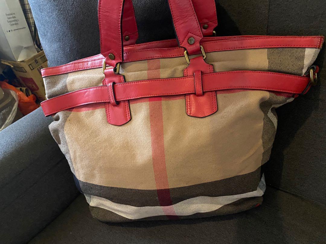 Burberry check canvas padlock tote bag (Category: Tote Bags) located in Quezon City. Submitted by ec_rummage (Listing ID 1076576219, Image 2). Description: Burberry red canvas padlock &key tote bag With code and tag Still in very good condition With signs of usage Size: large can fit 13” macbook Flaws: see pictures @ bag strap edge No sling strap Very tiny ink mark ( unnoticeable) .