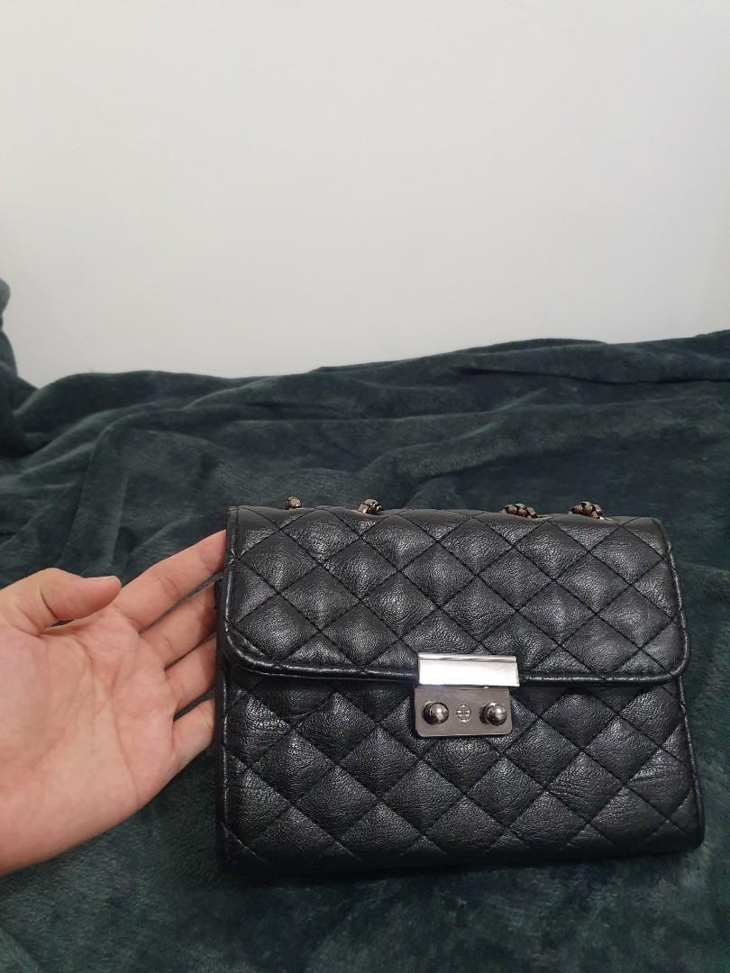 Black Shoulder/Sling Bag (Category: Luxury Bags & Wallets) located in Meycauayan. Submitted by b.declutters (Listing ID 1077116560, Image 1). Description: My go to bag. 7/10 Condition. Super ganda..