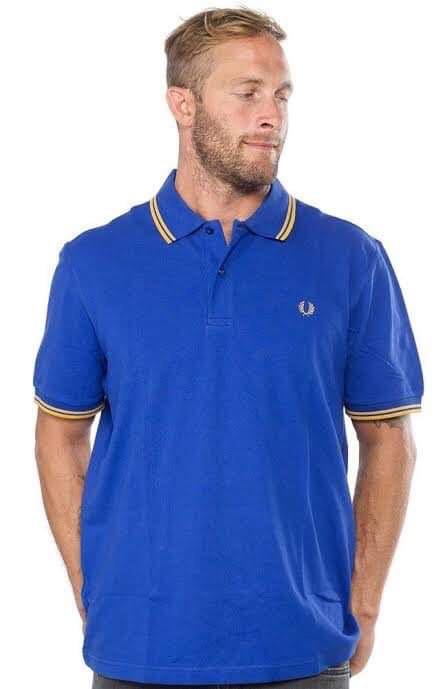 Fred Perry Polo Shirt (Blue/Gold) (Category: Tshirts & Polo Shirts ) located in Taguig. Submitted by monozcart (Listing ID 1075612341, Image 1). Description: - Original - With minor stains from storage (see last 2 pics).