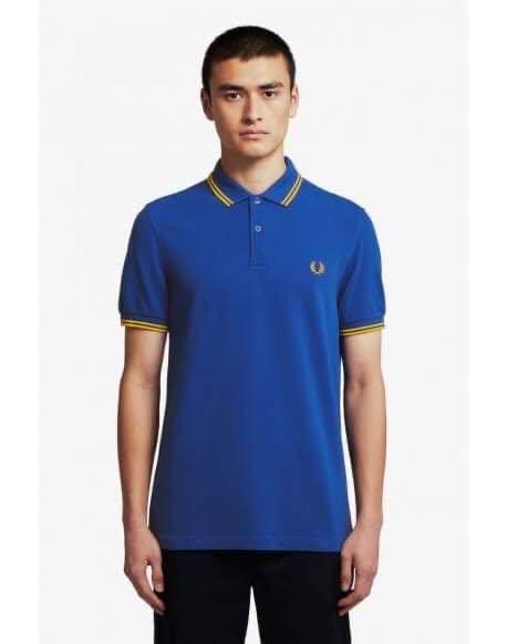 Fred Perry Polo Shirt (Blue/Gold) (Category: Tshirts & Polo Shirts ) located in Taguig. Submitted by monozcart (Listing ID 1075612341, Image 2). Description: - Original - With minor stains from storage (see last 2 pics).
