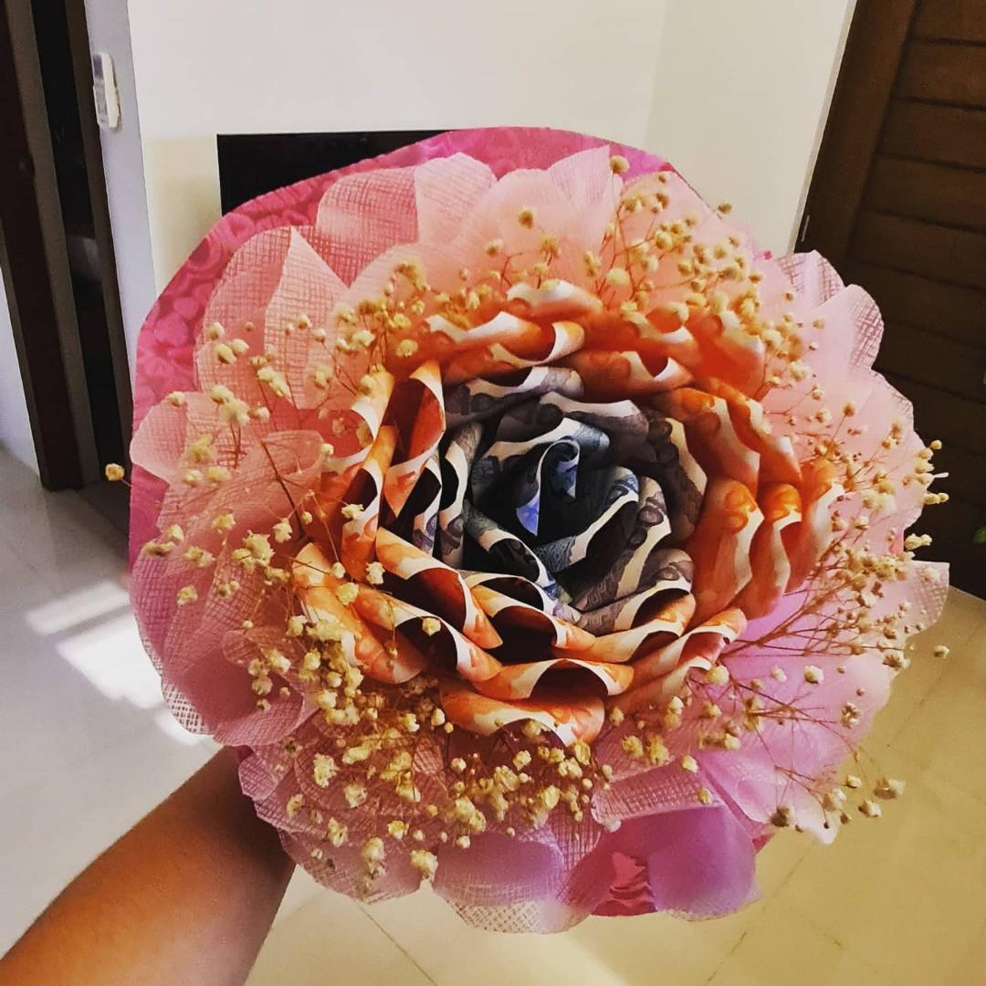 PRE-ORDER!!!! Rose-shaped MONEY BOUQUET (Category: Luxury Accessories) located in Quezon City. Submitted by frostize (Listing ID 1076988253, Image 2). Description: Looking for gift ideas but coming up empty? Money bouquet is the answer!!! Creation time: 4-5 days Rush orders have additional fees Shipping fee c/o buyers For more inquiries just contact me!.