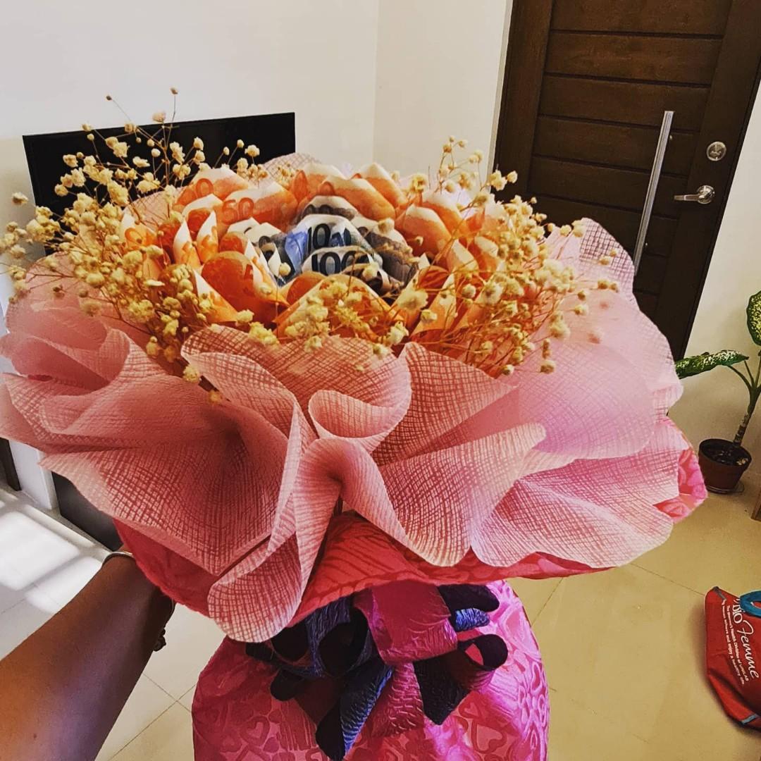 PRE-ORDER!!!! Rose-shaped MONEY BOUQUET (Category: Luxury Accessories) located in Quezon City. Submitted by frostize (Listing ID 1076988253, Image 1). Description: Looking for gift ideas but coming up empty? Money bouquet is the answer!!! Creation time: 4-5 days Rush orders have additional fees Shipping fee c/o buyers For more inquiries just contact me!.