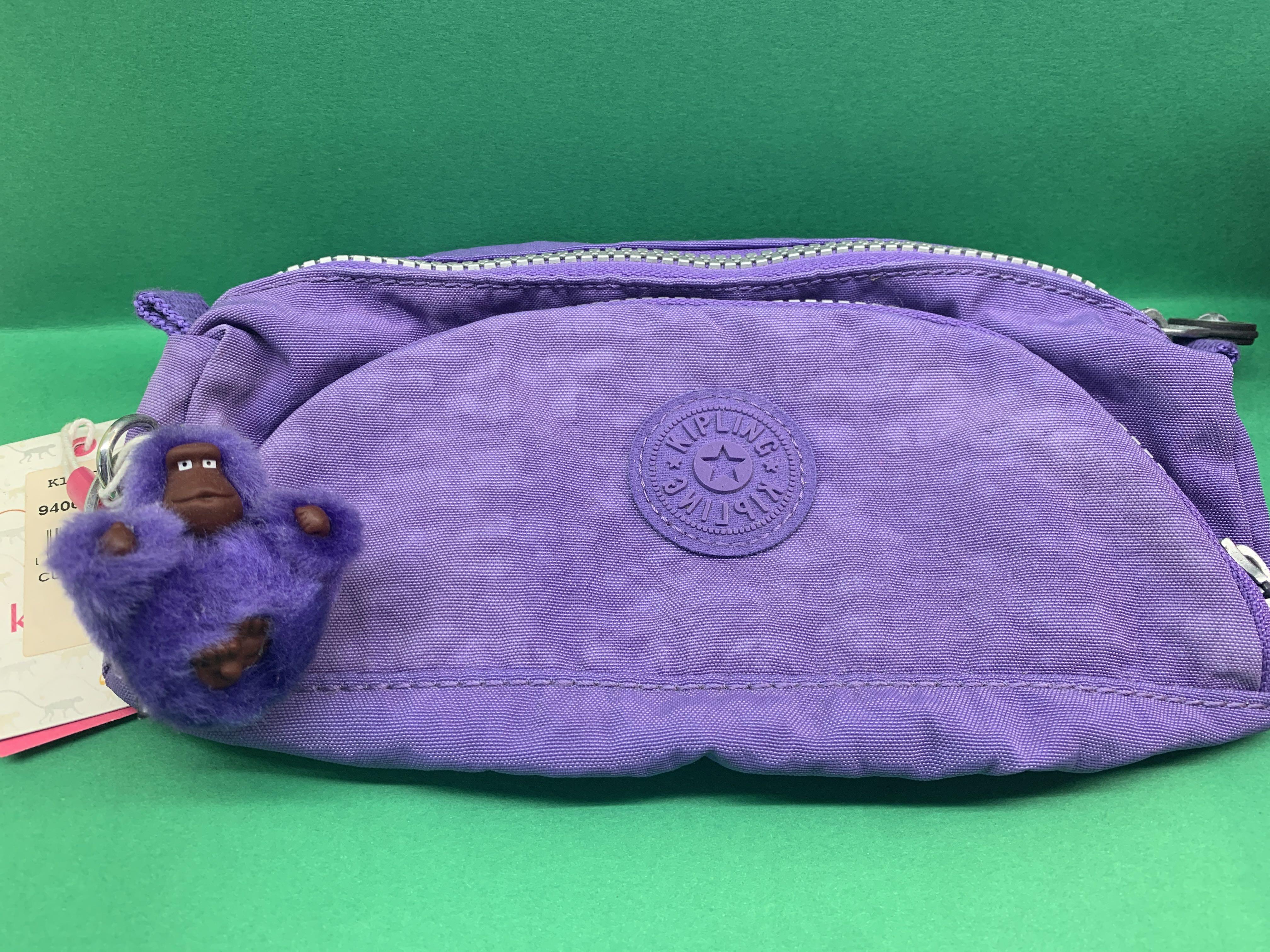 Kipling Pouch (Category: Stationery & School Supplies) located in Singapore. Submitted by lee_mainchar (Listing ID 245800436, Image 1). Description: - New and unused - Price tag is still on - Vivid purple - Suitable to use as pencil case or make up pouch - Cute monkey keychain just like all Kipling products - Zips are all in perfect working conditions Feel free to ask me more about the conditions or photos of the product .