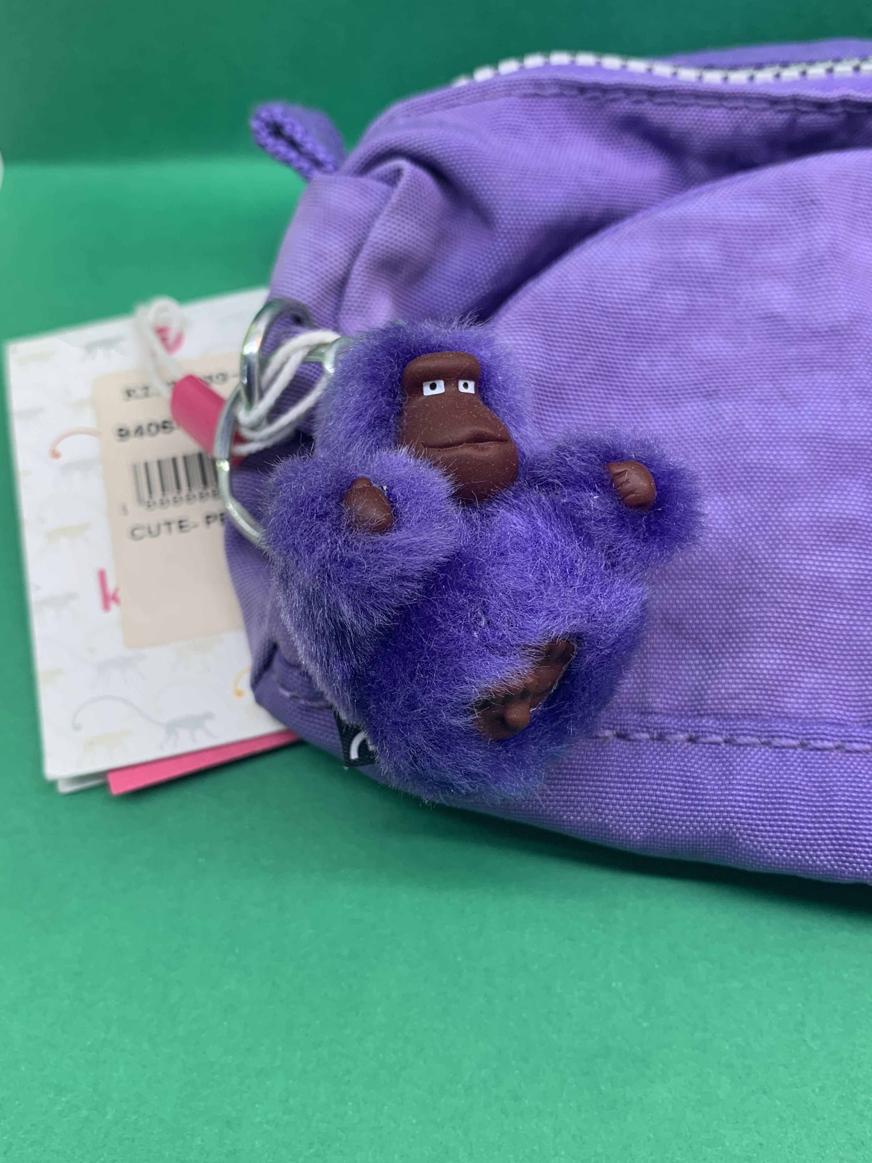 Kipling Pouch (Category: Stationery & School Supplies) located in Singapore. Submitted by lee_mainchar (Listing ID 245800436, Image 2). Description: - New and unused - Price tag is still on - Vivid purple - Suitable to use as pencil case or make up pouch - Cute monkey keychain just like all Kipling products - Zips are all in perfect working conditions Feel free to ask me more about the conditions or photos of the product .
