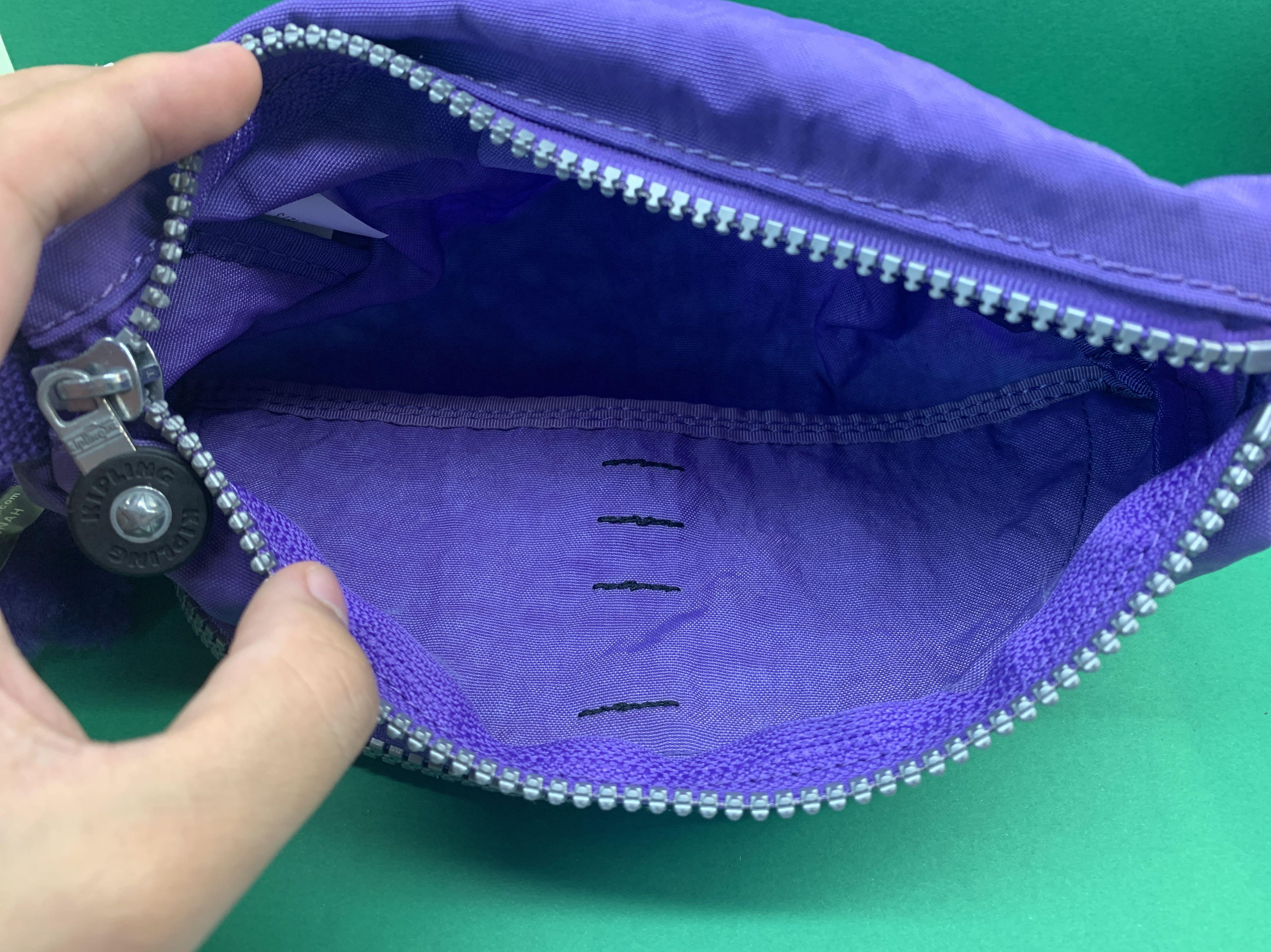 Kipling Pouch (Category: Stationery & School Supplies) located in Singapore. Submitted by lee_mainchar (Listing ID 245800436, Image 4). Description: - New and unused - Price tag is still on - Vivid purple - Suitable to use as pencil case or make up pouch - Cute monkey keychain just like all Kipling products - Zips are all in perfect working conditions Feel free to ask me more about the conditions or photos of the product .