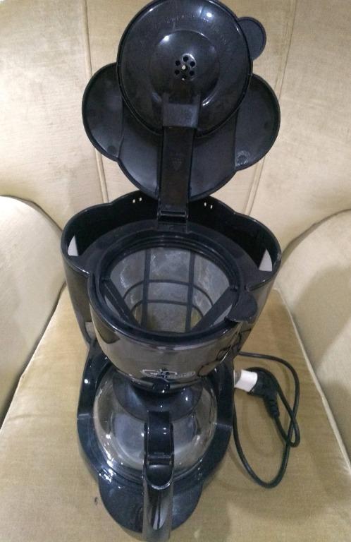 De Longhi Drip Coffee (Category: Coffee Machines & Makers) located in Quezon City. Submitted by magenta888 (Listing ID 1078168928, Image 2). Description: The coffee maker is like new. I got this from Rustans at around P4k. Specs below: Weight (Kg): 1,7 Rated voltage/Frequency (V~Hz): 220-240 V / 50-60 Hz Input power (W): 900 Choose your favourite colour: Black Autoshut OFF: ✓ Carafe: Glass Coffee filter: Paper Controls: Buttons Cups: 10 External 