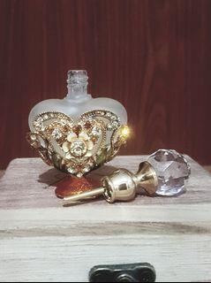 Elegant perfume bottle in gemstones