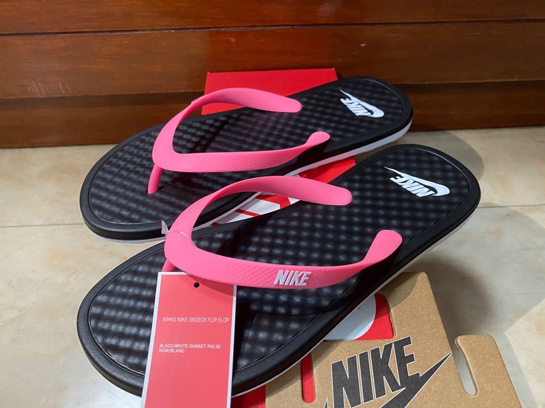 buy nike slippers at 50 off