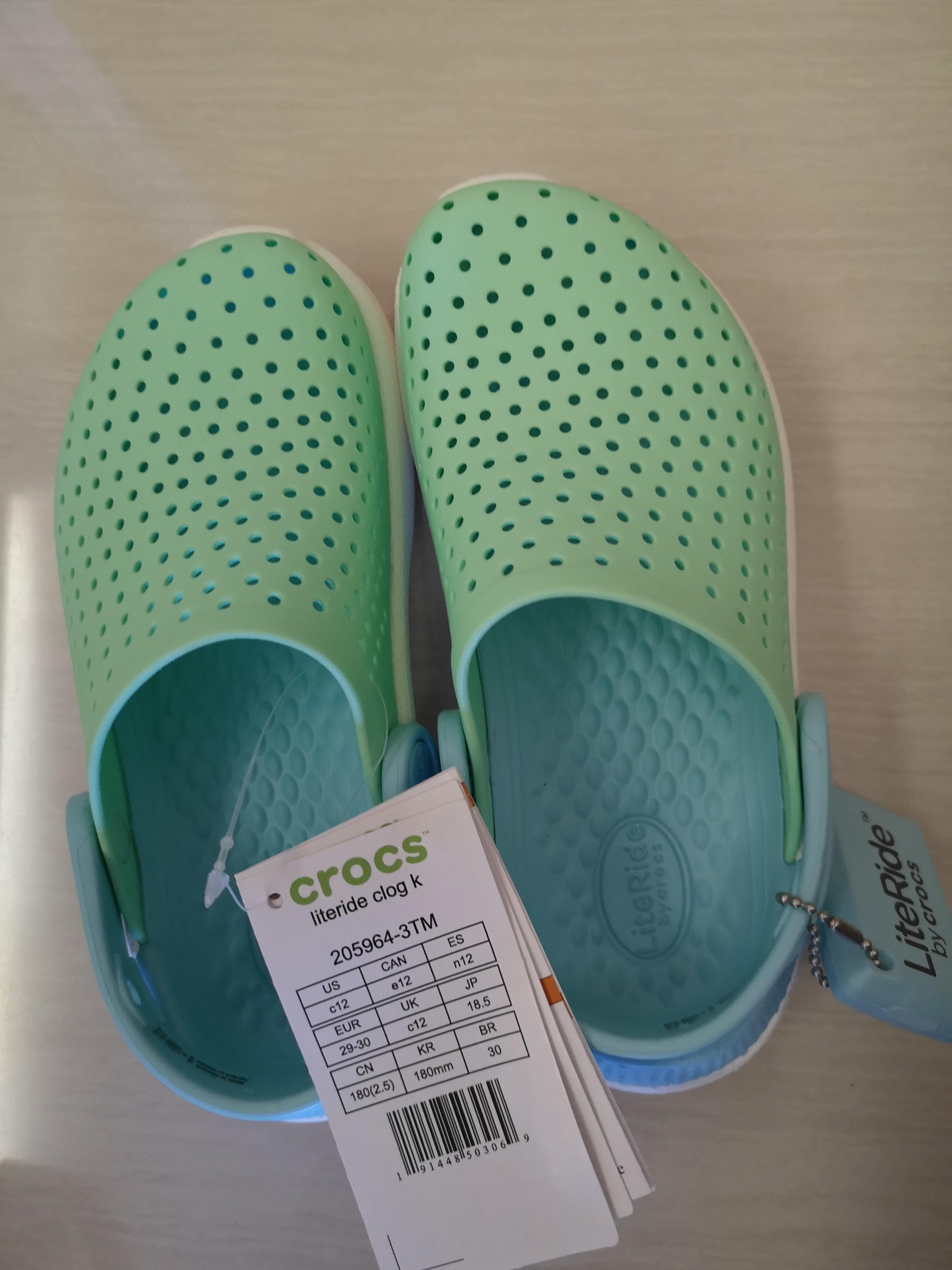 Pastel green crocs on sale
