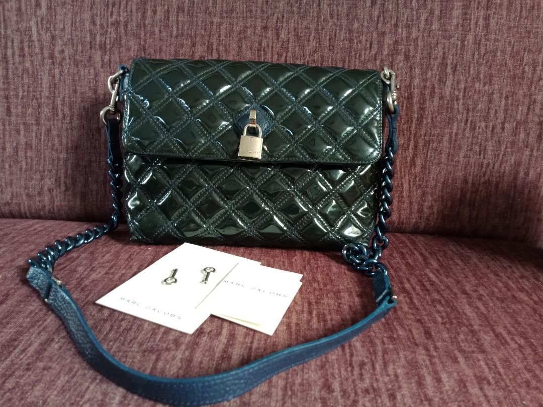 Marc Jacobs Blue Patent Quilted Single Flap Shoulder Bag (Category: Luxury Bags & Wallets) located in Marikina City. Submitted by len_cat (Listing ID 1078599199, Image 2). Description: Brand New Marc Jacobs Bag Just stored in the closet With removabke chain/leather sling Interior - Lined with beige canvas and zipper pocket Measures: 9" x 3" x 7".