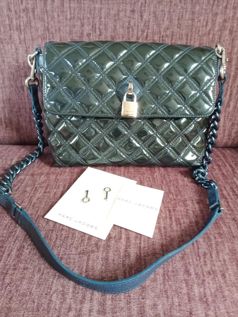 Marc Jacobs Blue Patent Quilted Single Flap Shoulder Bag (Category: Luxury Bags & Wallets) located in Marikina City. Submitted by len_cat (Listing ID 1078599199, Image 1). Description: Brand New Marc Jacobs Bag Just stored in the closet With removabke chain/leather sling Interior - Lined with beige canvas and zipper pocket Measures: 9" x 3" x 7".