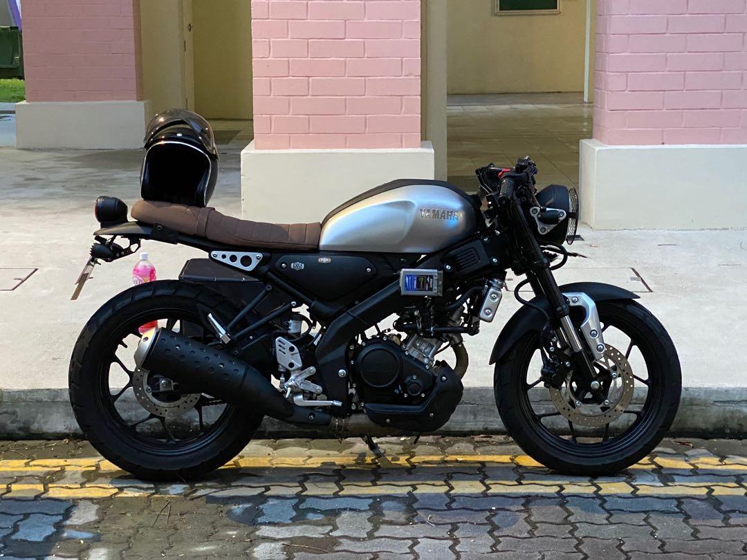 Black motorcycle with brown seat best sale