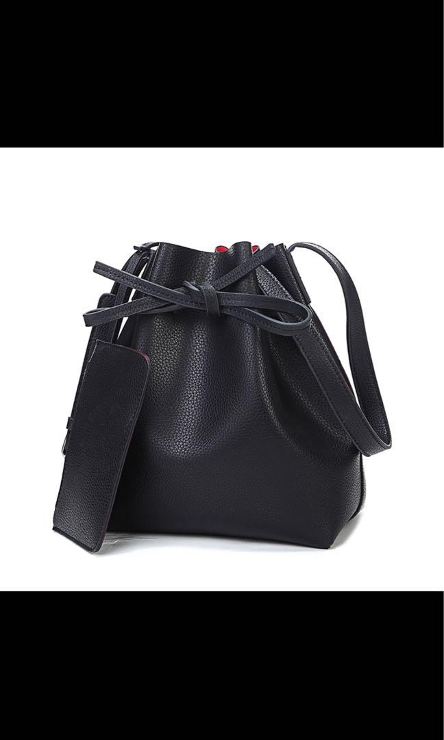 Black bucket bag clearance with red lining