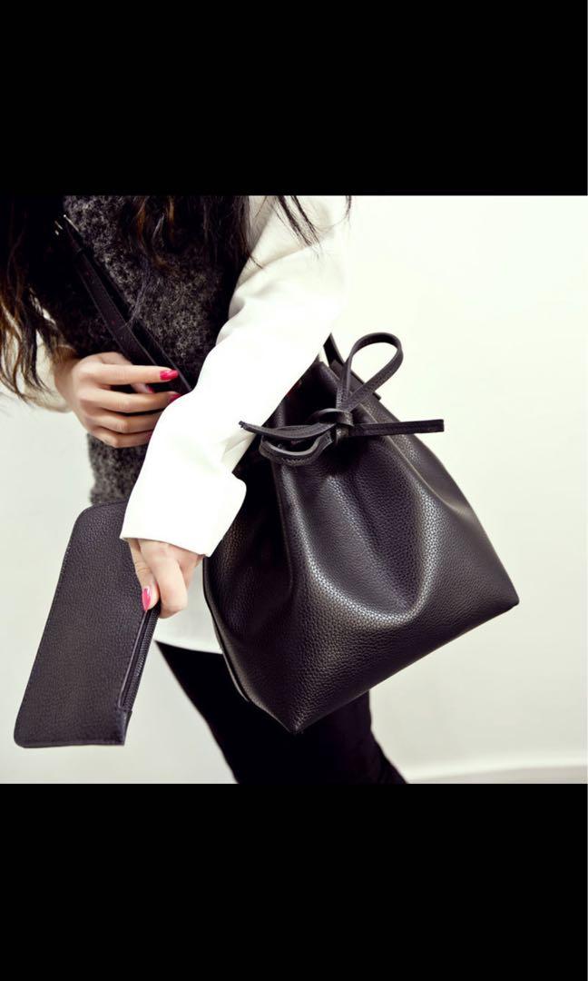Black bucket bag clearance with red lining