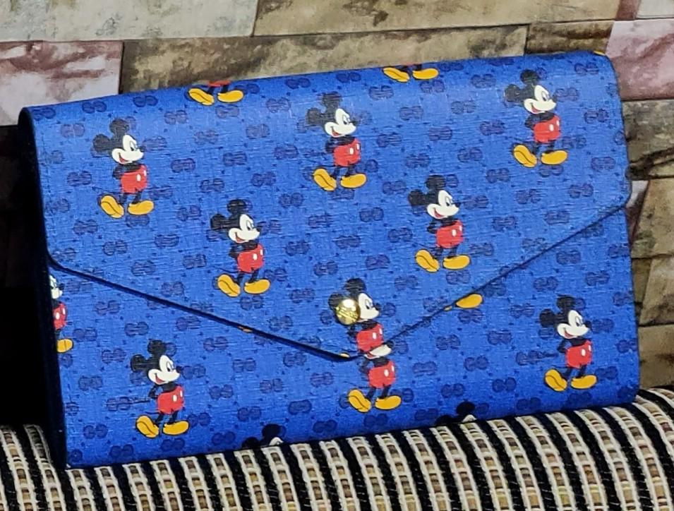 Gucci Mickey Blue Wallet/Sling (Category: Luxury Bags & Wallets) located in Makati City. Submitted by pinaypreneur (Listing ID 1073647887, Image 1). Description: Used once by my daughter. Lots of card pocket. Can fit big two phone inside. Shipping to be shouldered by buyer..