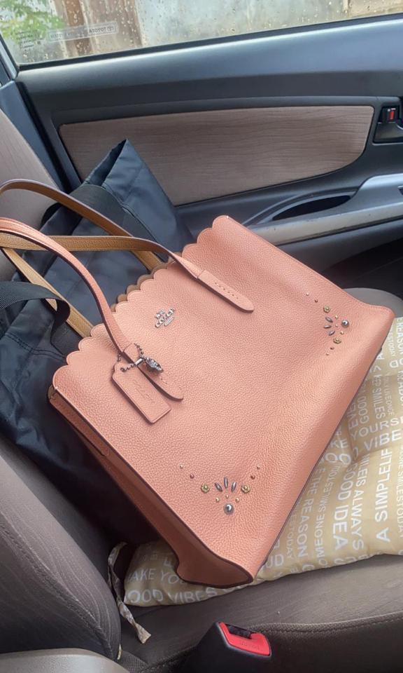 Coach charlie carryall with rivets on sale