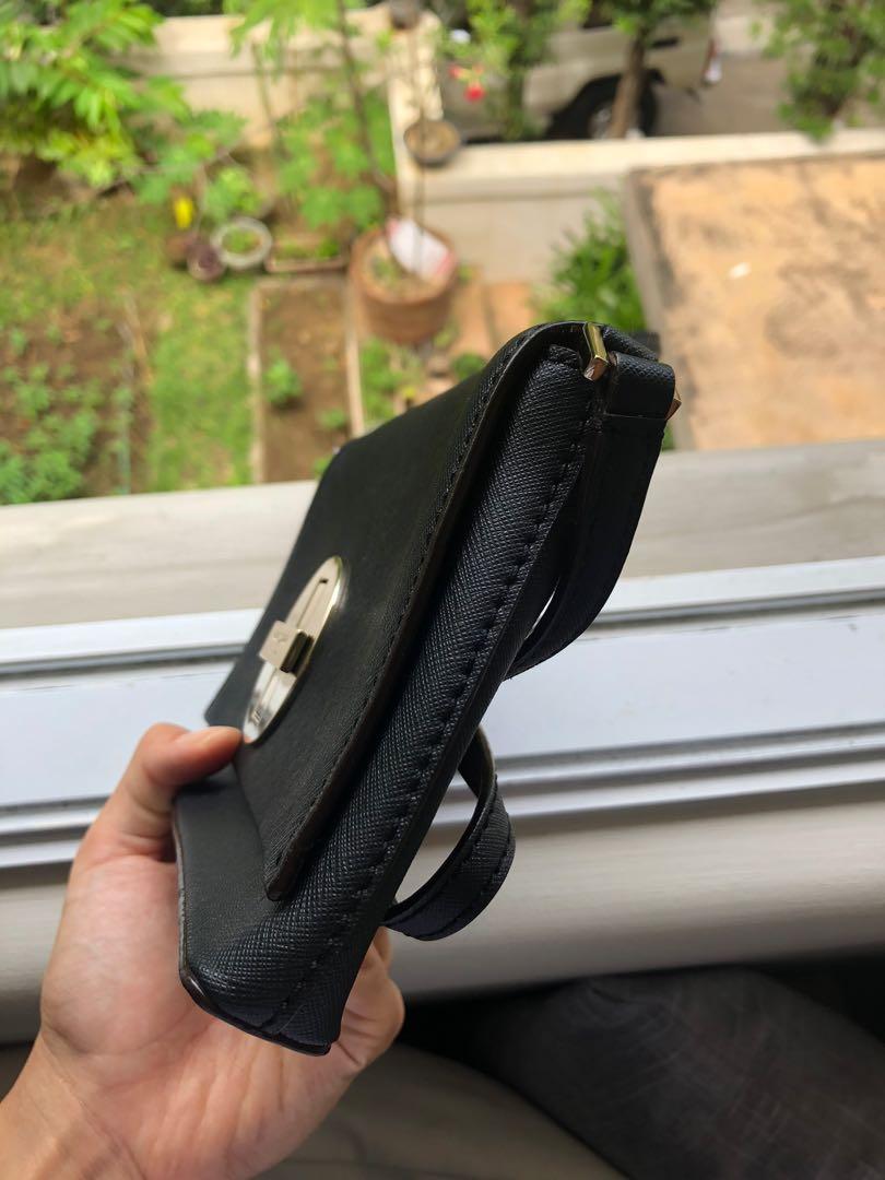 Kate Spade (USA) shoulder bag black (Category: Luxury Bags & Wallets) located in Muntinlupa City. Submitted by aniella_ (Listing ID 1073811893, Image 2). Description: Authentic black Kate Spade shoulder bag. Never used, tag still attached. Silver hardware. Small pocket inside. Condition: 9/10. With slight stains (can be washed off) inside as it has been in storage, unused for a long time. Kate Spade dust bag included. Message me for more details.