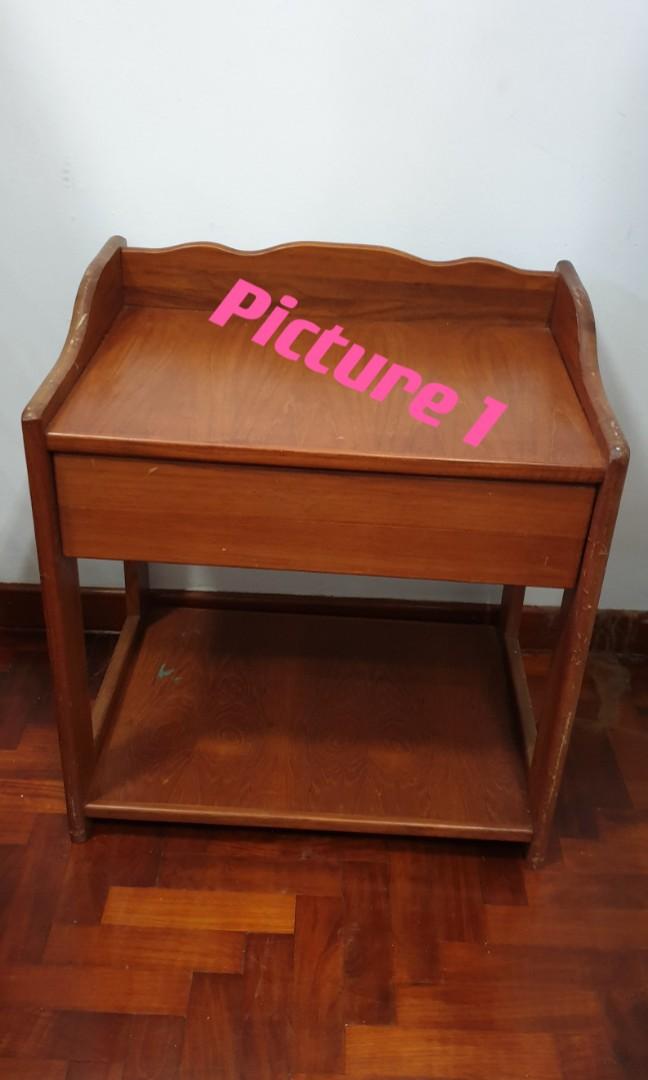 Side Table (Category: Tables & Sets) located in Singapore. Submitted by kozie (Listing ID 1016556689, Image 2). Description: Picture 1: Solid wood side table. Seldom used thus selling. Comes with a pull out drawer. Condition is good. Not for fussy buyer. Measurement: Length 21 inches Breadth: 15.5 inches Height: 22.5 inches Pls arrange yr own transport. Cash & carry..