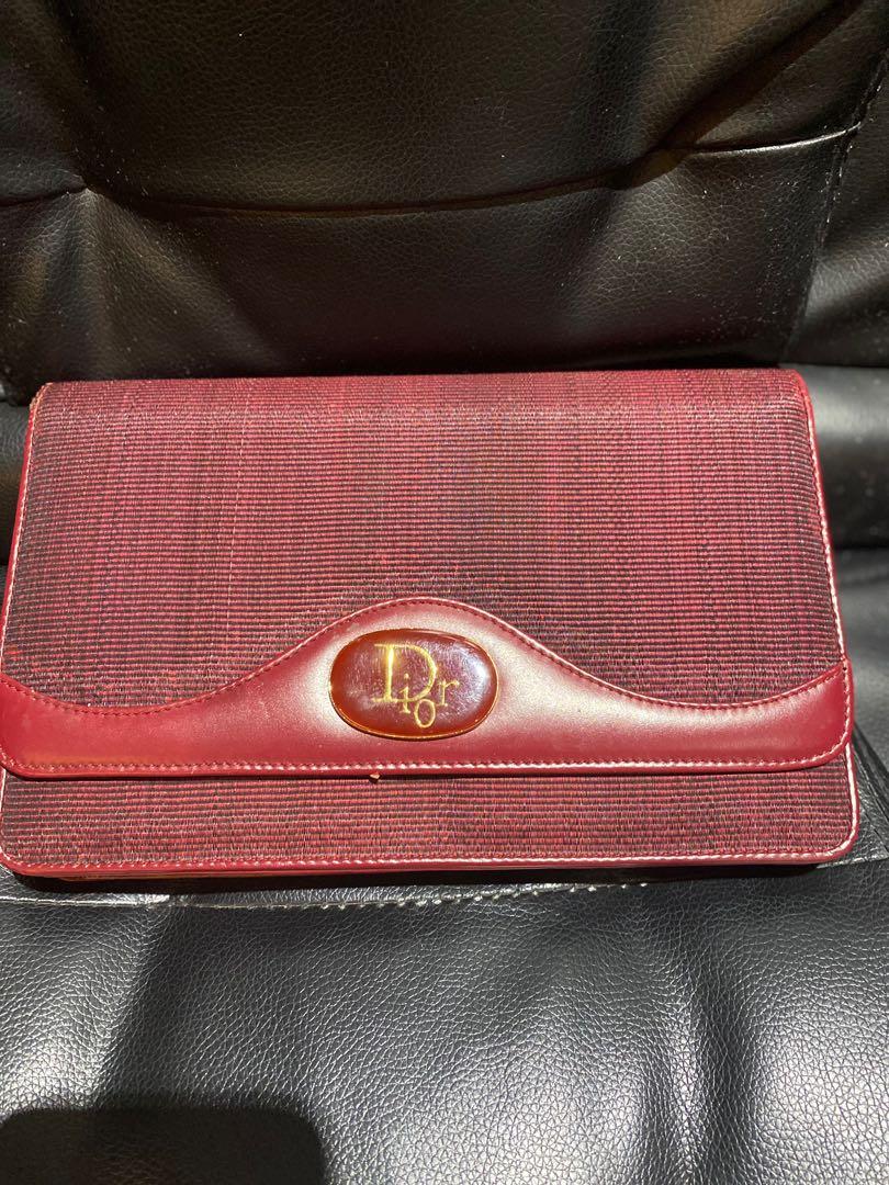 Authentic Christian Dior clutch (Category: Luxury Bags & Wallets) located in Paranaque City. Submitted by french21closet (Listing ID 1080737372, Image 3). Description: Authentic Vintage Christian Dior Clutch Color: Dark Red applicable for sling flaws as seen in the last photos “Please expect signs of usage and manage your expectations” For serious takers only PM me if interested: SMS 09174506853.