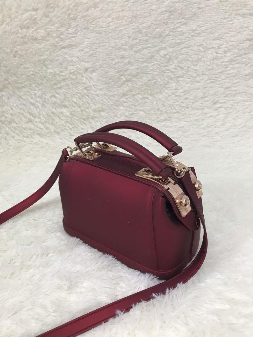 Maroon sling bag store