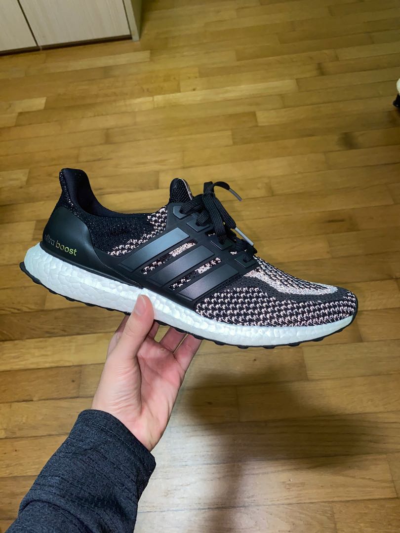 Ultra boost black online reflective on feet