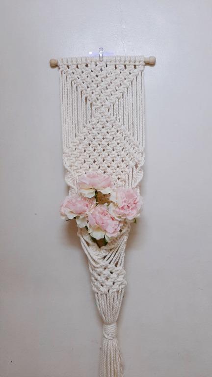 Macrame Plant, Artificial/Preserved Flower Succulents Wall Hanging (Category: Wall Decor) located in Manila. Submitted by chiero_sells (Listing ID 1081821886, Image 1). Description: unique way to display your plants, artificial/preserved flowers and succulents? color/size used: cream/5mm product length: 9 inches × 27 inches *artificial flower shown in the pic isn't included* you can customize it if u want cream/4mm or ash white/3mm pm for more de