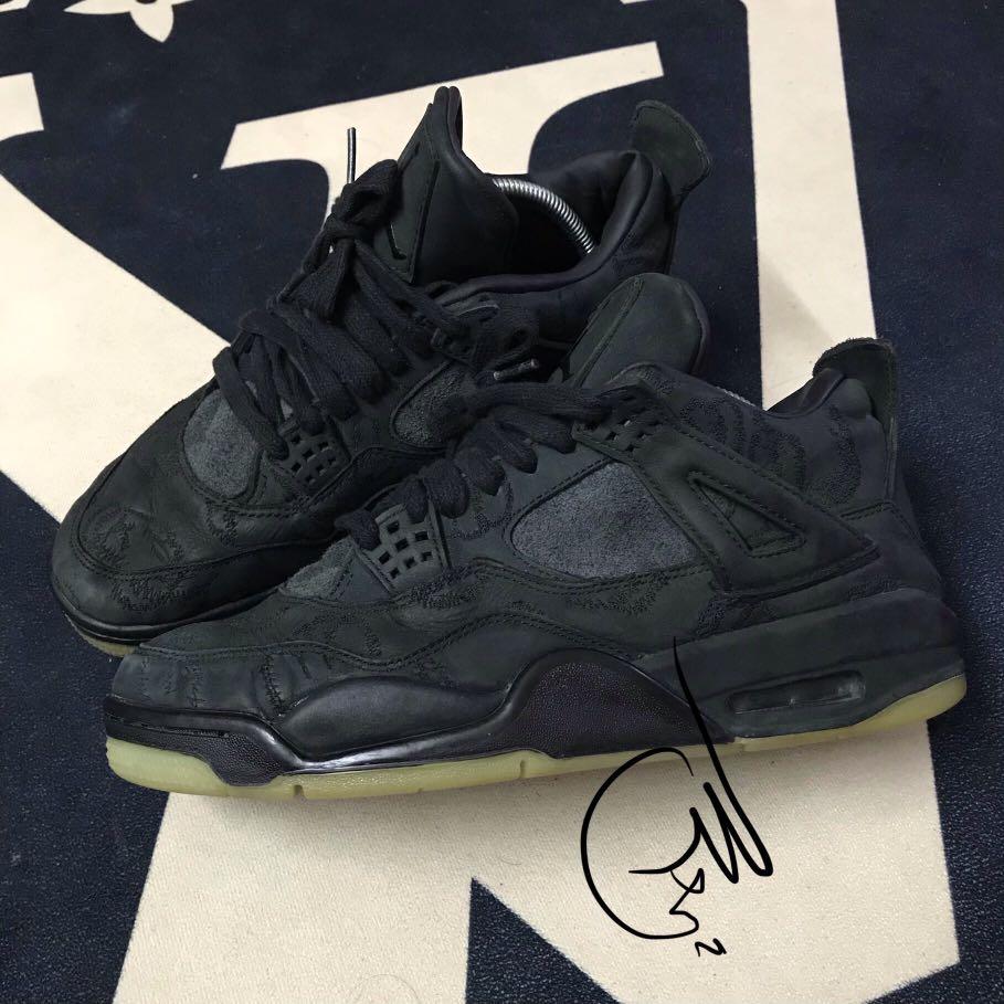 aj4 kaws black