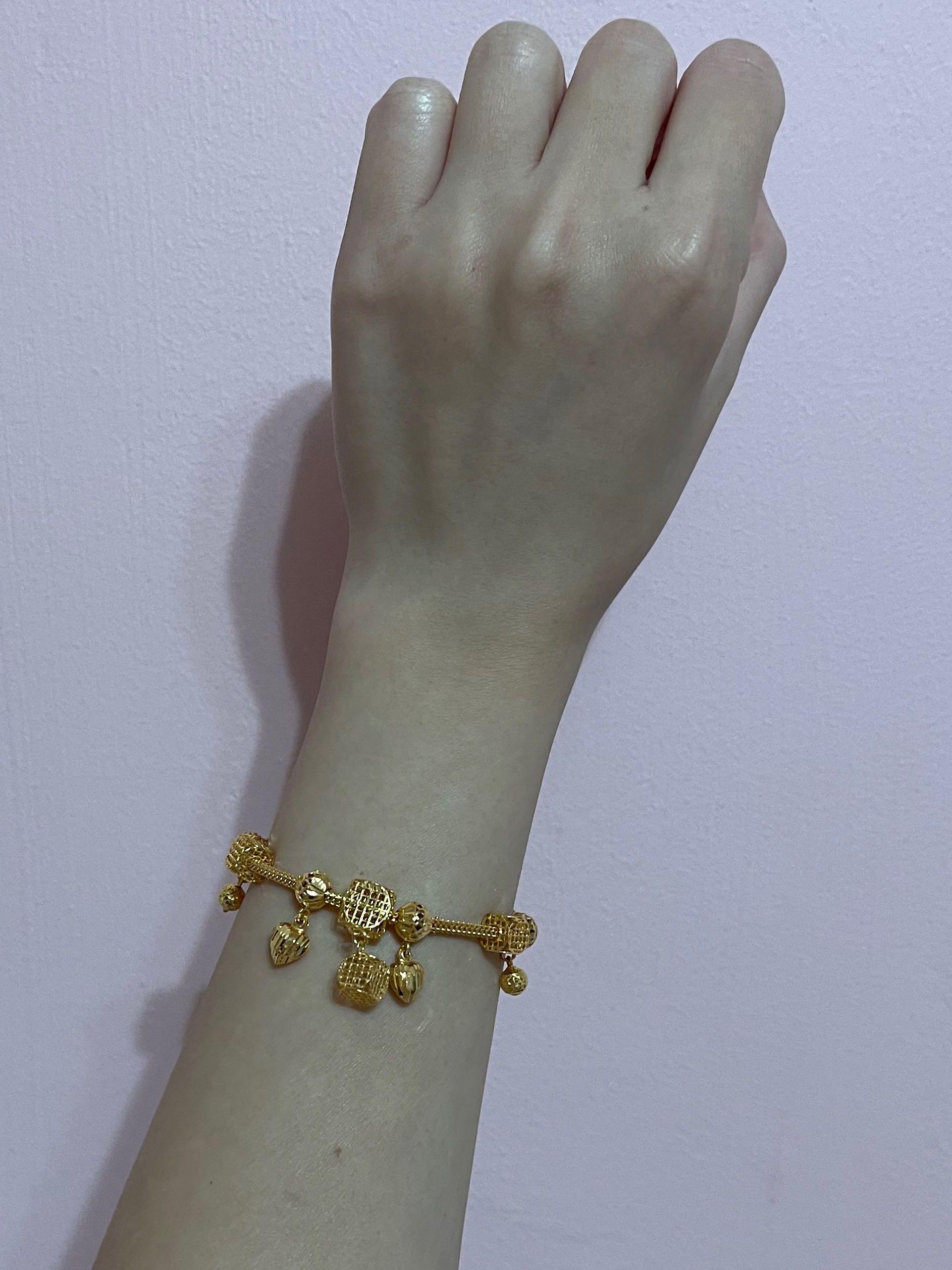 Gold bangle with charm sales