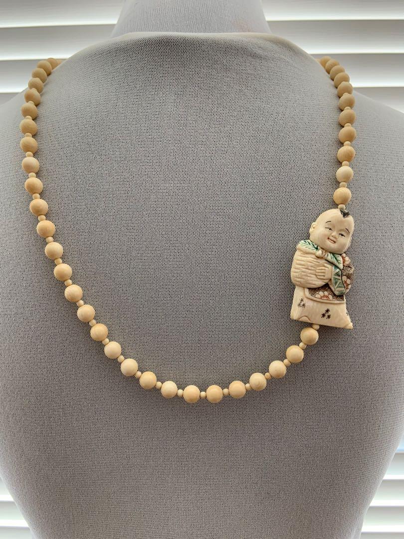 Carved ivory discount bead necklace