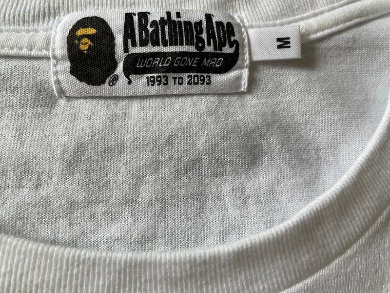 Bape Script Tee (Category: Tshirts & Polo Shirts) located in Singapore. Submitted by user2310 (Listing ID 1082491246, Image 2). Description: Worn 2-3x max and folded in cupboard since. Rarely worn Size M fits L (boxy relaxed tee) WTS only Not looking for trades .