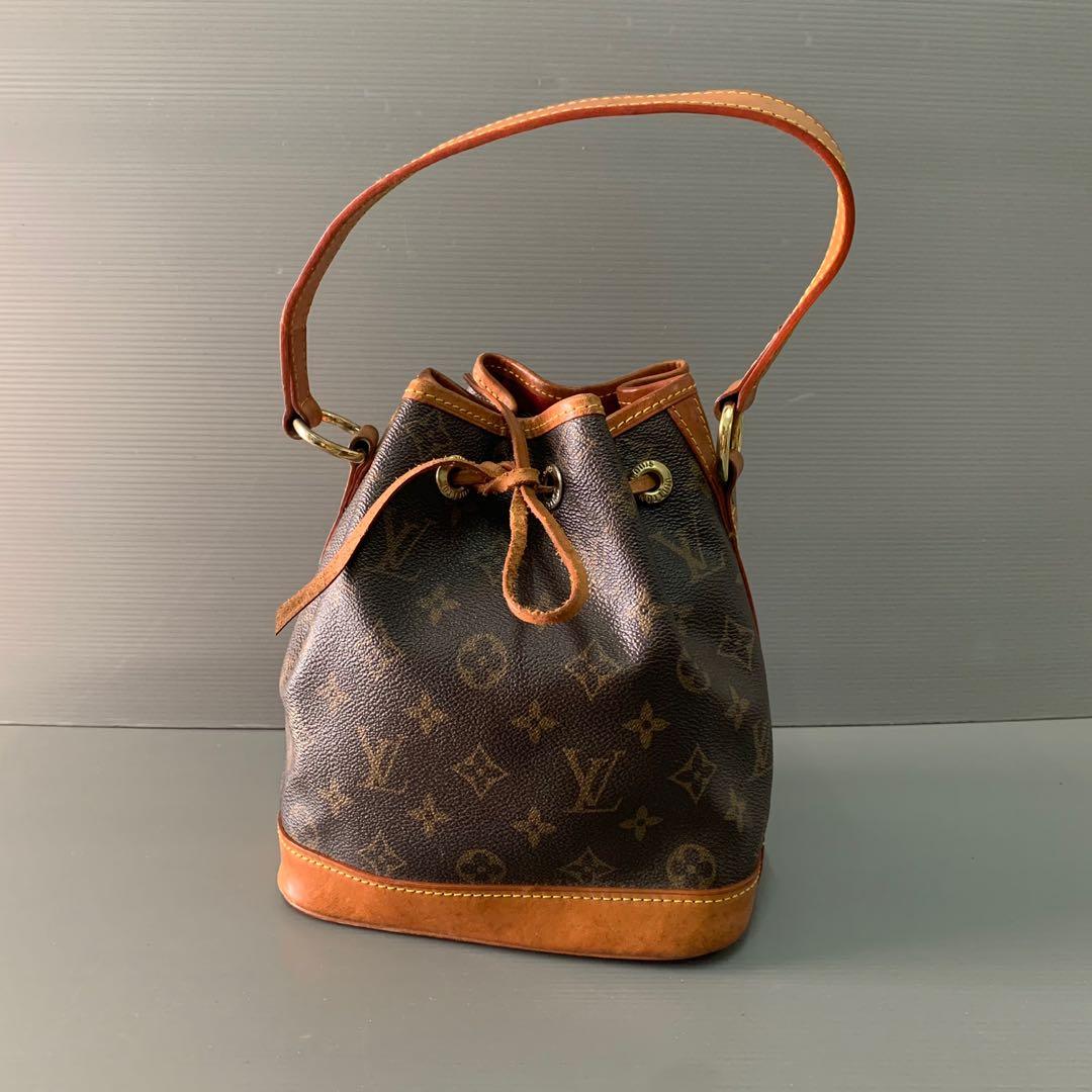 Louis Vuitton  Louis Vuitton old yellow leather suction button water Cup Bag  Mini bucket bag mobile phone bag with magnet button design leather with LV  hardware buckle element bag body delicate