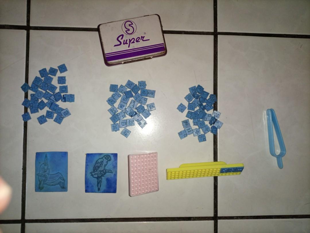 Stamp set (Category: Craft Supplies & Tools) located in Quezon City. Submitted by vans_online_store (Listing ID 1079086227, Image 2). Description: Stamp set stamp pad is already dry (violet) 2nd hand but still in good condition Capital letters - 30 pcs Small letters - 32 pcs Numbers and symbols - 30 pcs Bird characters - 2 pcs (some letters and numbers ay naddoble) Rfs: Hindi na nagagamit The stamp set comes with character holders (as seen in the