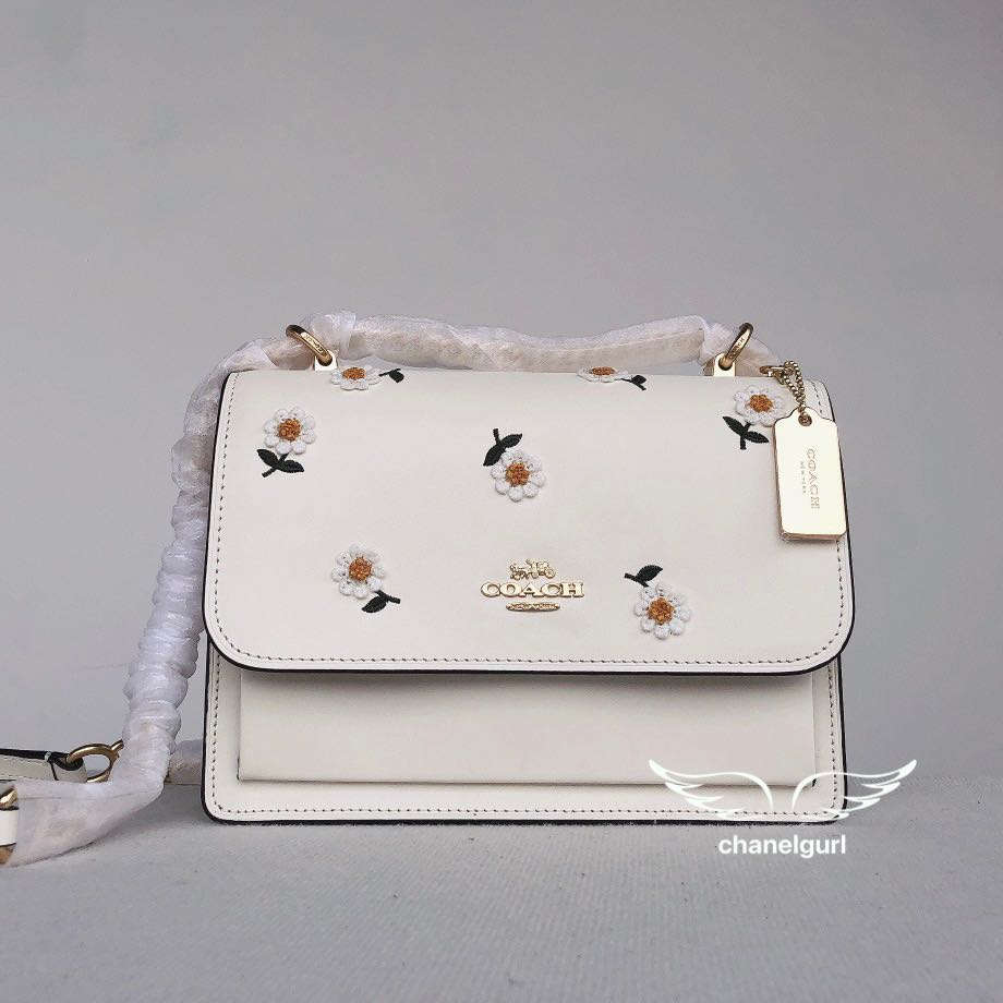 klare crossbody with daisy embroidery