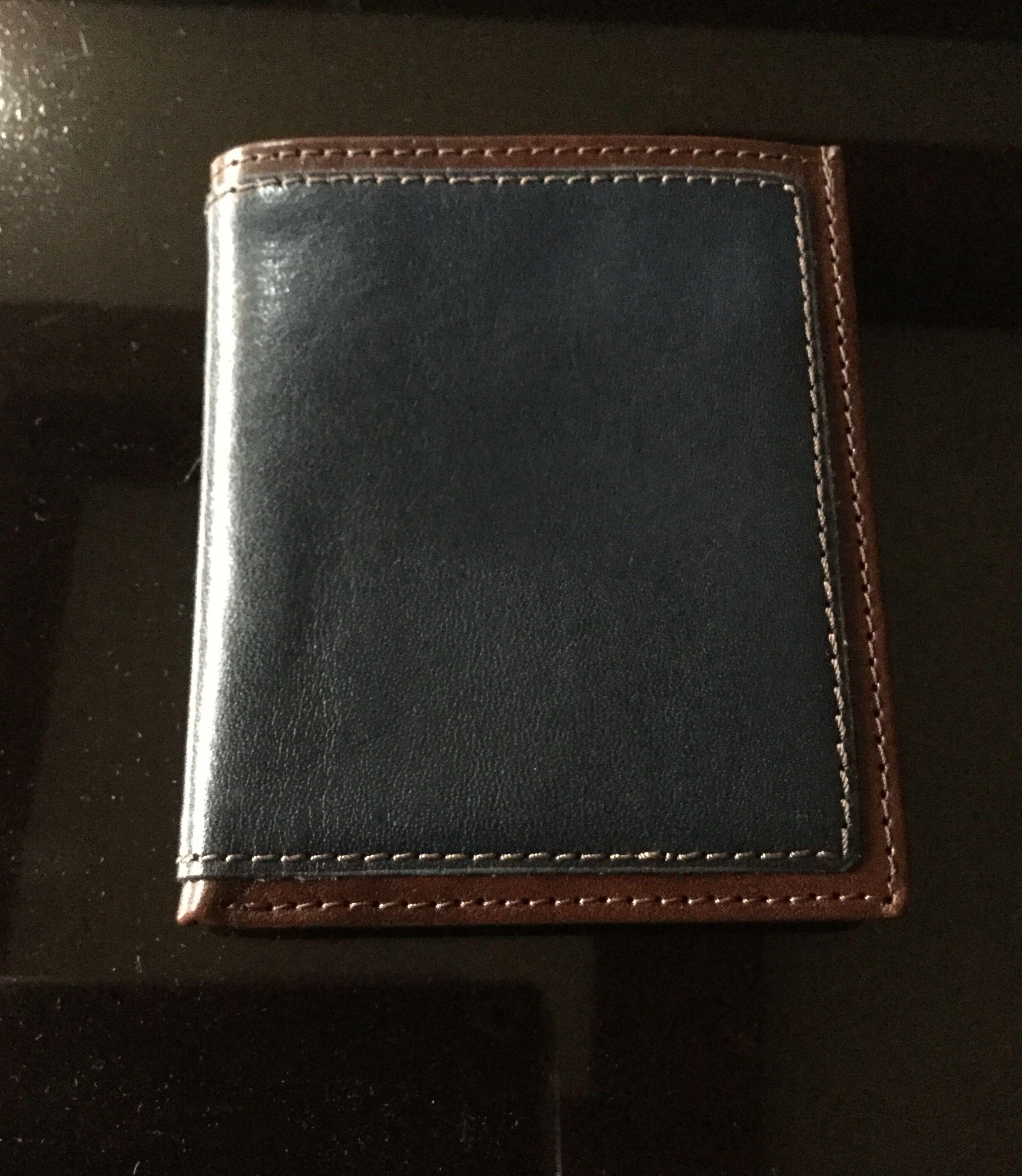 Danier Leather Wallet (Category: Wallets & Card Holders) located in Quezon City. Submitted by lftanco (Listing ID 1059068705, Image 2). Description: Danier pure leather wallet for men in navy blue and dark brown colour. Made and bought in Canada .