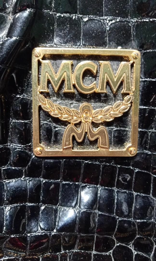 MCM Crocskin travel bag (Category: Luxury Bags & Wallets) located in Caloocan City. Submitted by drum_beater (Listing ID 1083871865, Image 3). Description: duffle type patent leather brass hardwares Approx : 18x15x5 inches.