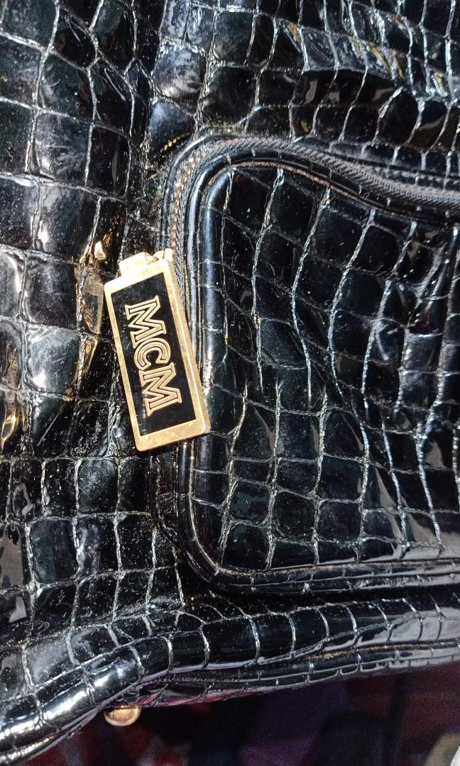 MCM Crocskin travel bag (Category: Luxury Bags & Wallets) located in Caloocan City. Submitted by drum_beater (Listing ID 1083871865, Image 2). Description: duffle type patent leather brass hardwares Approx : 18x15x5 inches.