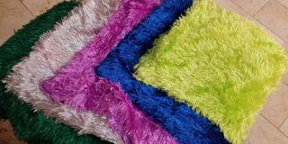 Throw pillow in soft, fluffy,colorful faux fur